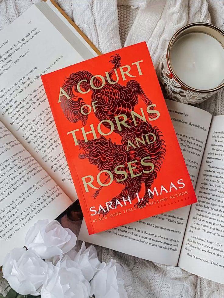 A COURT OF THORNS AND ROSES - Sarah J. Maas
